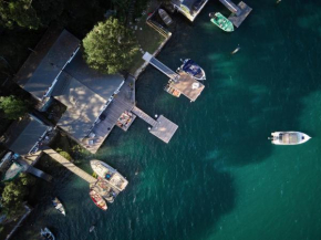 Tides Reach Boathouse water-access-only, Point Clare